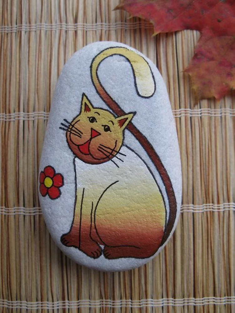 Steine bemalen lustige Katze Basteln mit Steinen