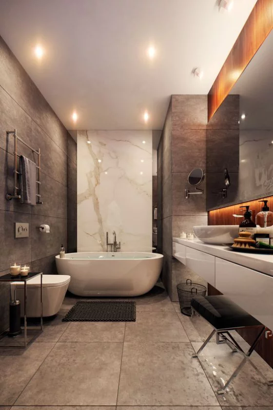 Braun modernes Badezimmer Fliesen in Großformat weiße Badewanne WC passende Beleuchtung