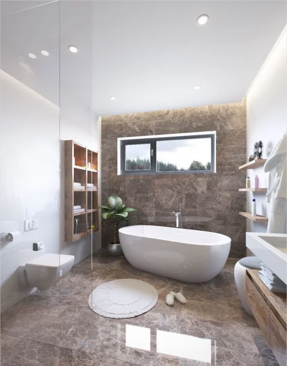 Braun modernes Badezimmer getrennt durch Glaswand Marmorfliesen weiße Badewannen WC Regal runder Teppich