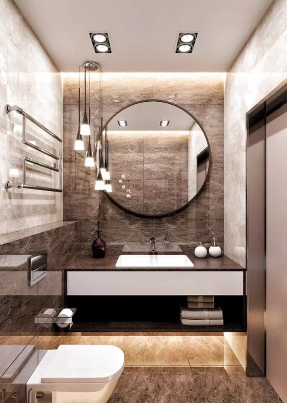 Braun modernes Badezimmer runder Spiegel Großformat Marmorfliesen gute Beleuchtung