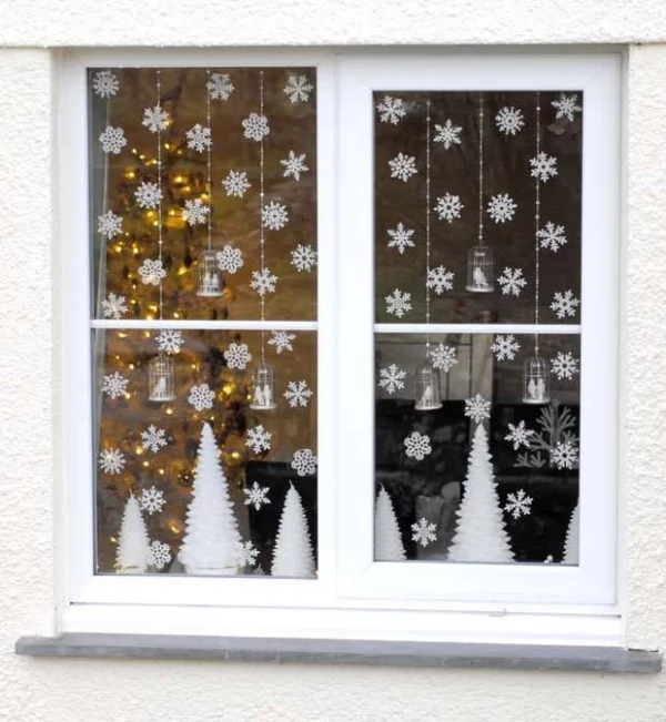 Fensterbilder basteln zu Weihnachten – zauberhafte Ideen und Anleitungen papierschnitte tannenbäume schneeflocken