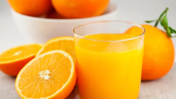 strahlende Gesichtshaut gesunde Lebensmittel Orangensaft trinken gesund und lecker
